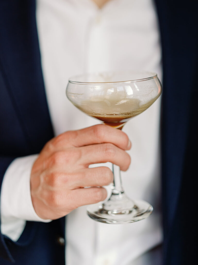 Man holding an espresso martini at Le Diplomate in Washington, DC